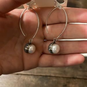 Pearl and intricate silver earring’s.